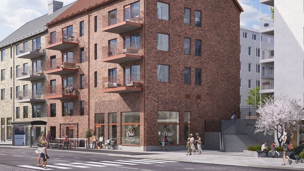 Stadsgata med fyrvåningsbyggnad i rött tegel - Hovår entré