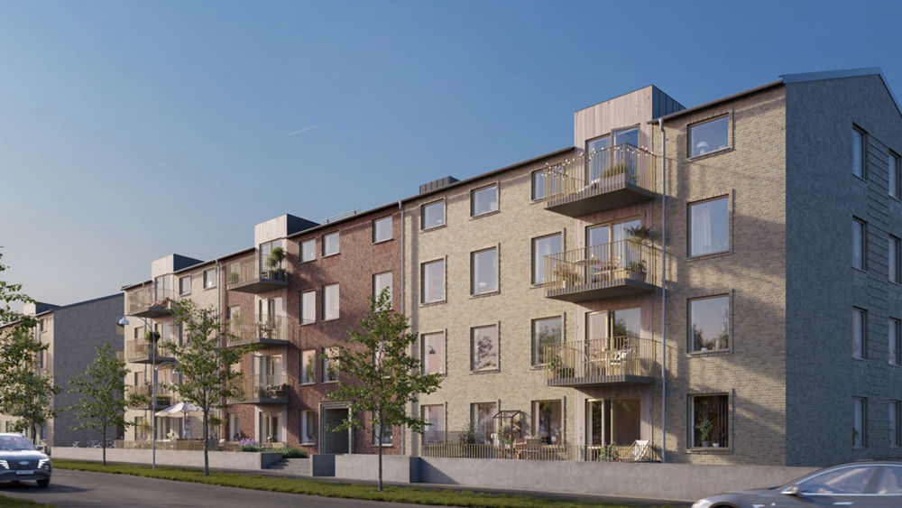 Brf Esplanaden - ett flerfamiljshus i fyra våningar med fasad i tegel och balkonger