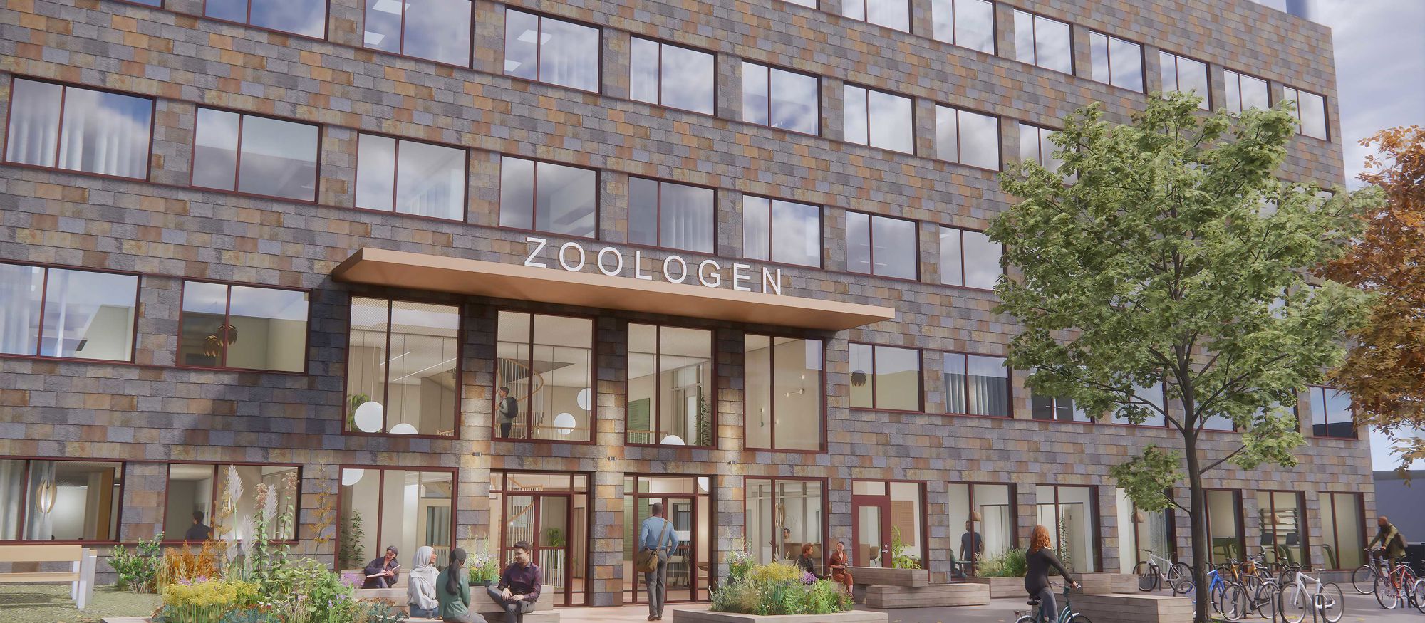 Gråbrun kontorsbyggnad med tegelfasad och entré med stora glaspartier - Zoologen