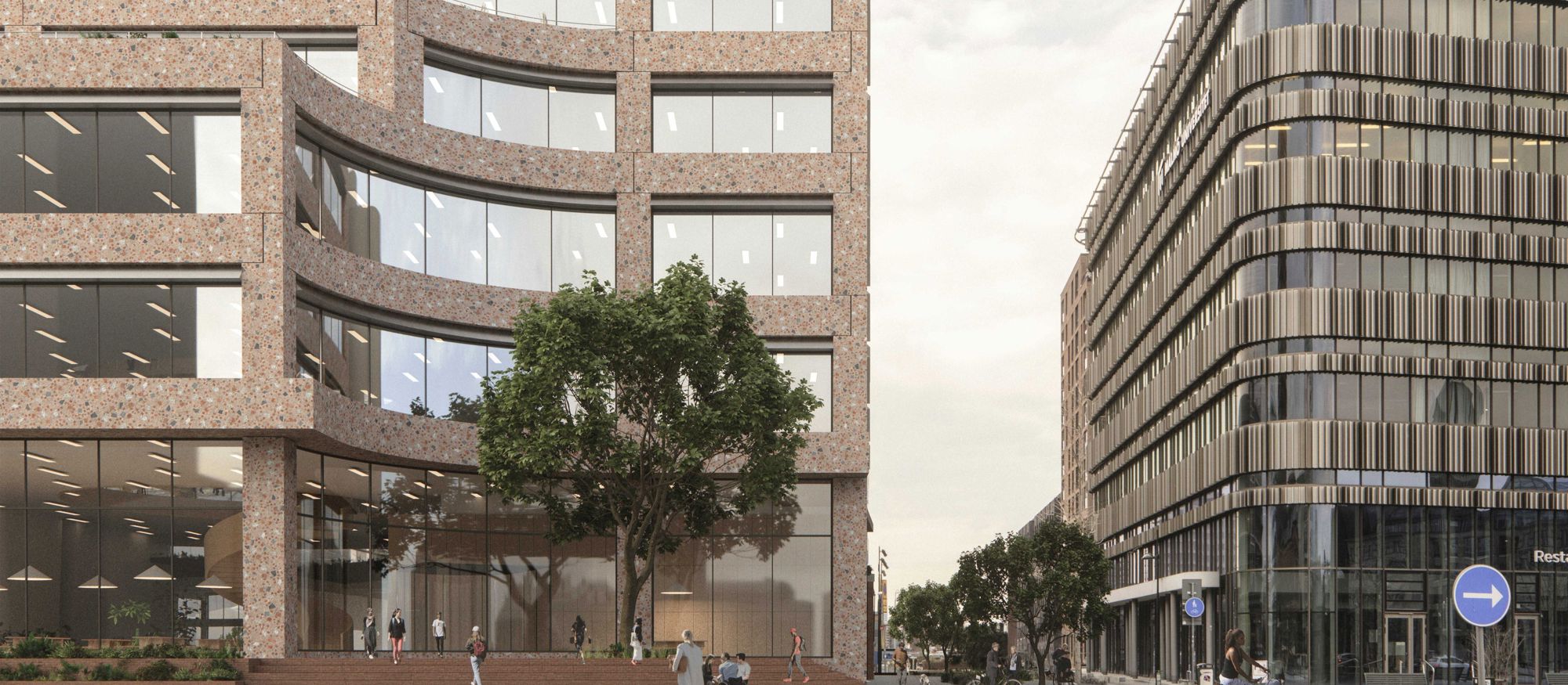 Exteriördbild på modernt flervåningshus med stora glasytor och fasad i terazzo