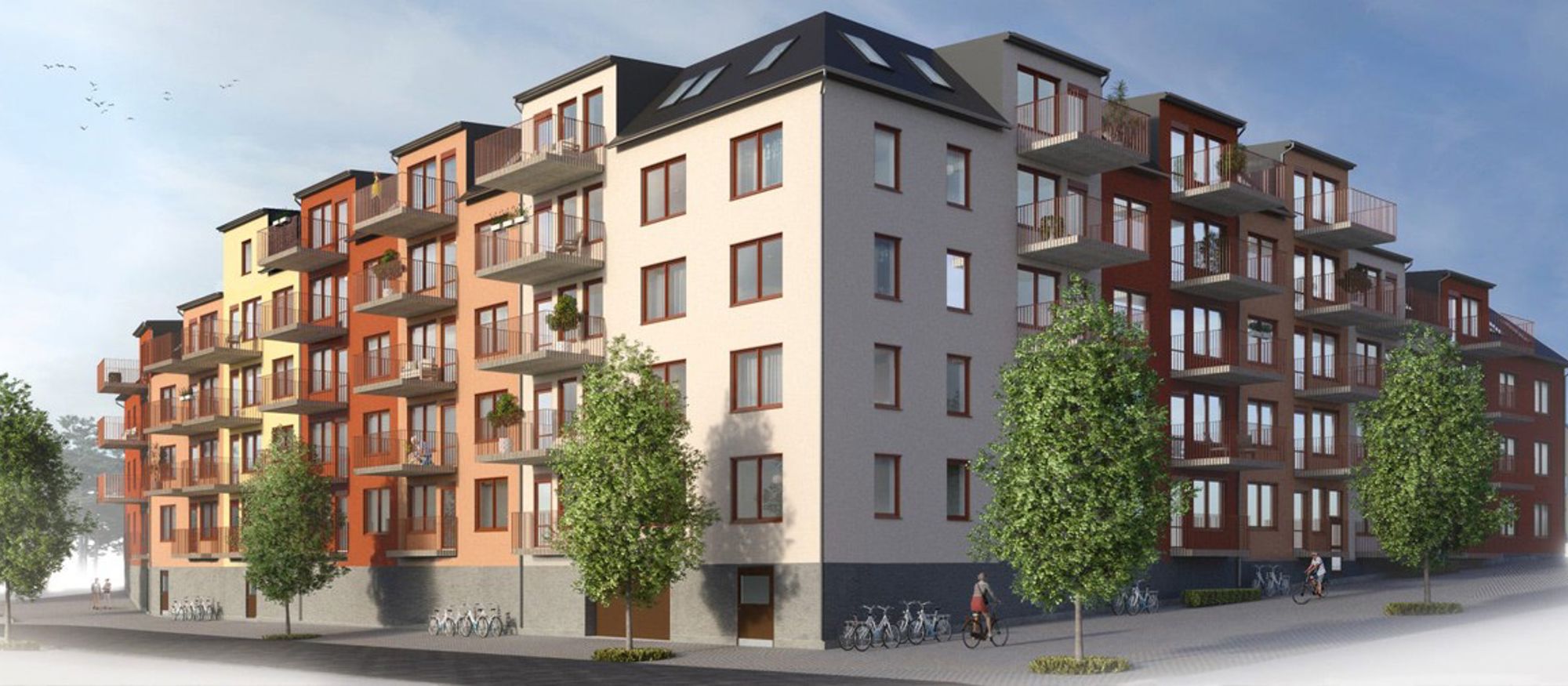 Stadskvarter i 4-5 våningar med balkonger och fasader i olika färger